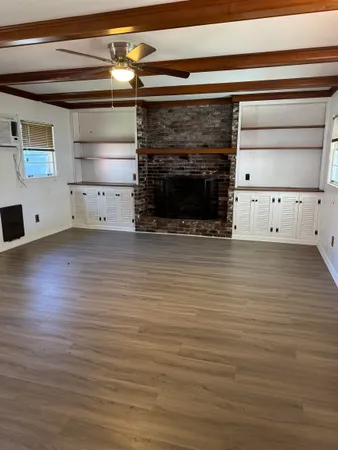 a kitchen with cabinets and appliances