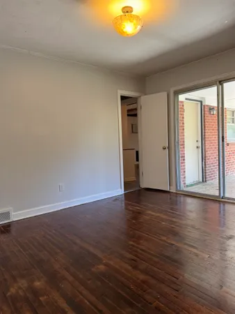 a view of an empty room with a balcony