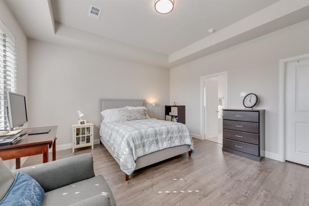 2301 Mount Olive Lane Forney, TX 75126 - Photo 11 of 36 a bedroom with a bed and furniture