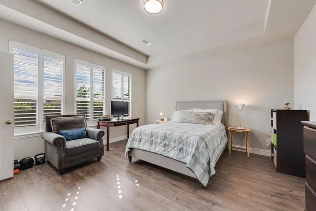 a bathroom with double sink and a mirror
