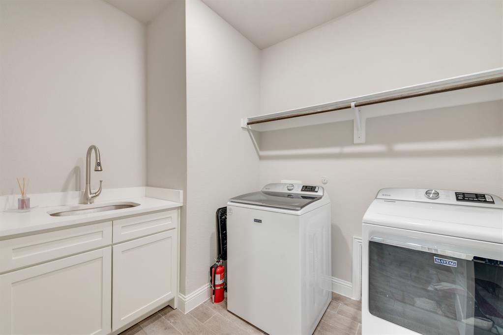 2301 Mount Olive Lane Forney, TX 75126 - Photo 16 of 36 a utility room with dryer and washer