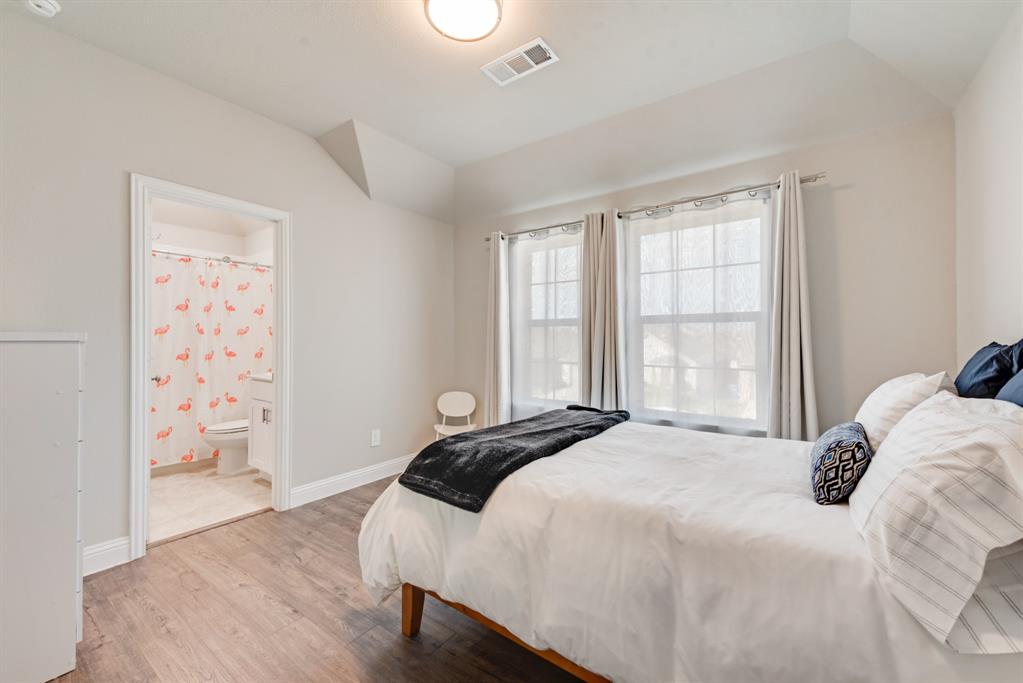 2301 Mount Olive Lane Forney, TX 75126 - Photo 21 of 36 a bedroom with a bed and a window