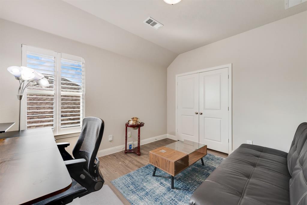 2301 Mount Olive Lane Forney, TX 75126 - Photo 25 of 36 a living room with furniture and a window
