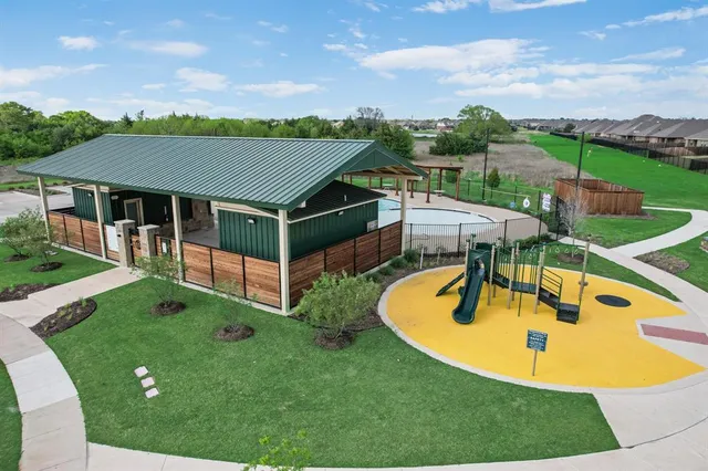 an aerial view of a sitting space with garden view and mountains