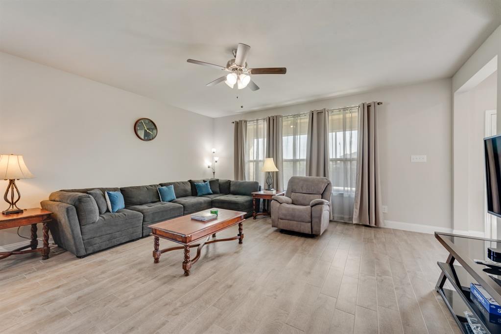 2301 Mount Olive Lane Forney, TX 75126 - Photo 9 of 36 a living room with furniture and a large window