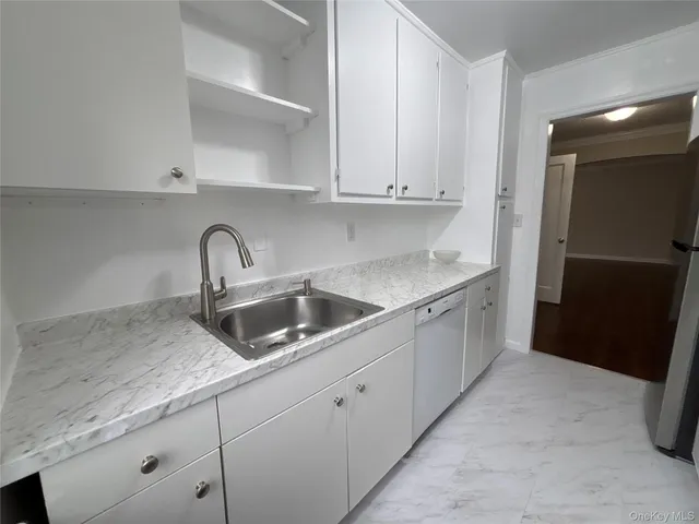 a kitchen with a sink and cabinets