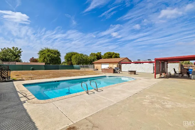 a view of a swimming pool with a patio