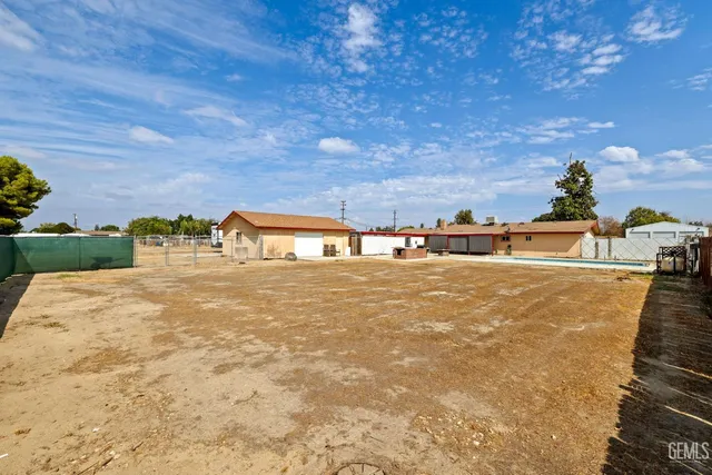 an aerial view of a house with outdoor space