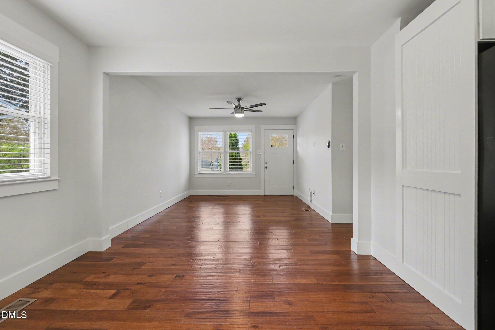 727 South State Street Raleigh, NC 27601 - Photo 7 of 30 an empty room with wooden floor and windows