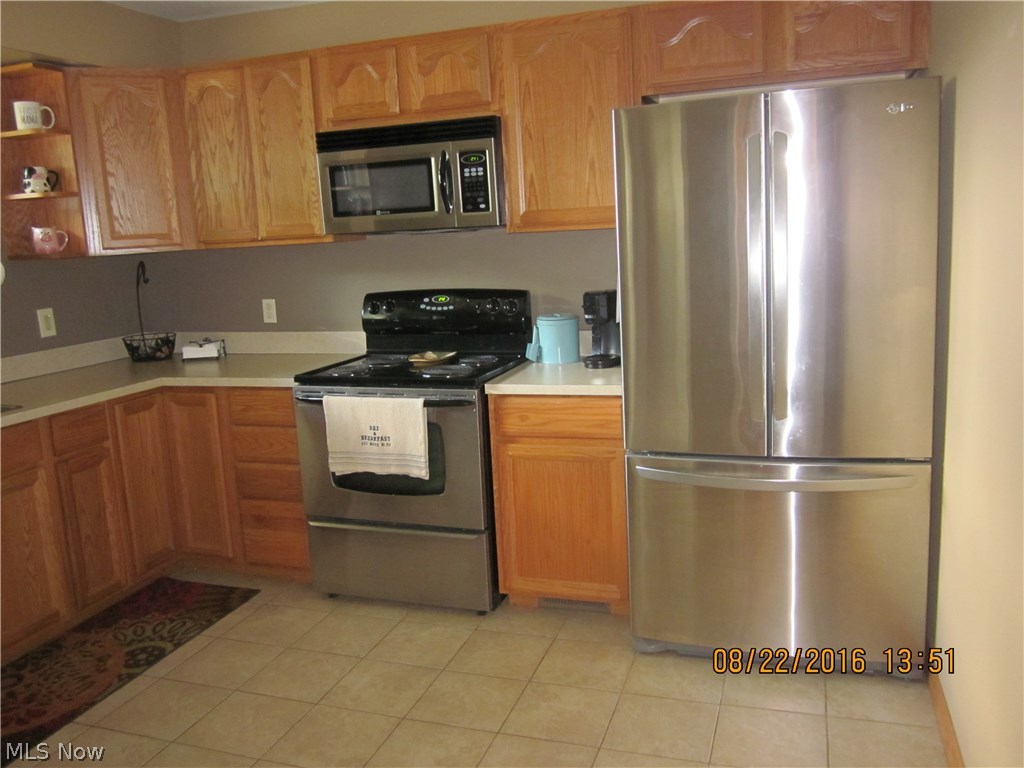 638 Substation Road Brunswick, OH 44212 - Photo 6 of 16 Updated kitchen with stainless appliances and ceramic flooring.
