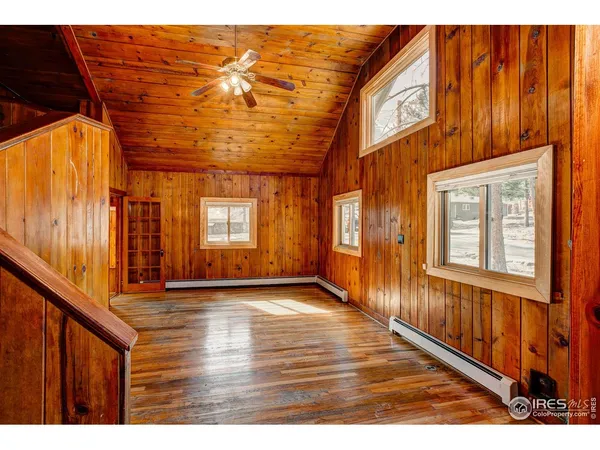 a view of an entryway with wooden floor