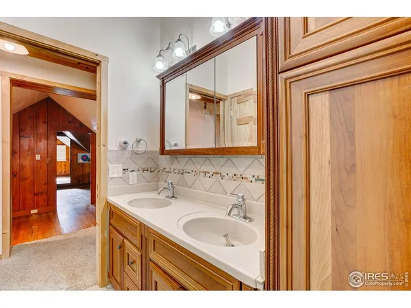 a bathroom with a sink a mirror and a bathtub