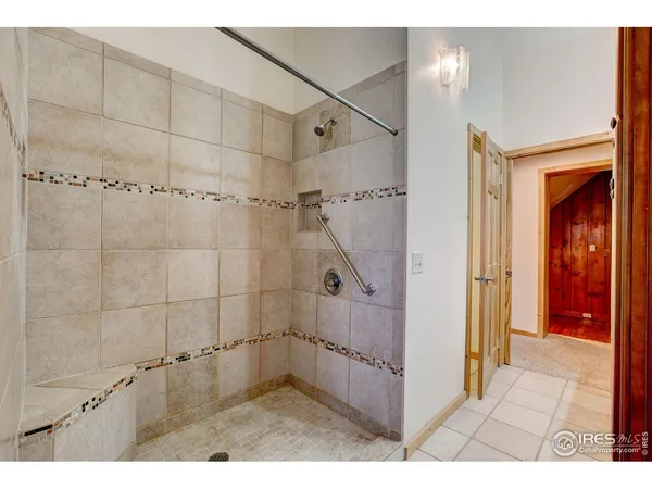 a bathroom with a shower and a sink