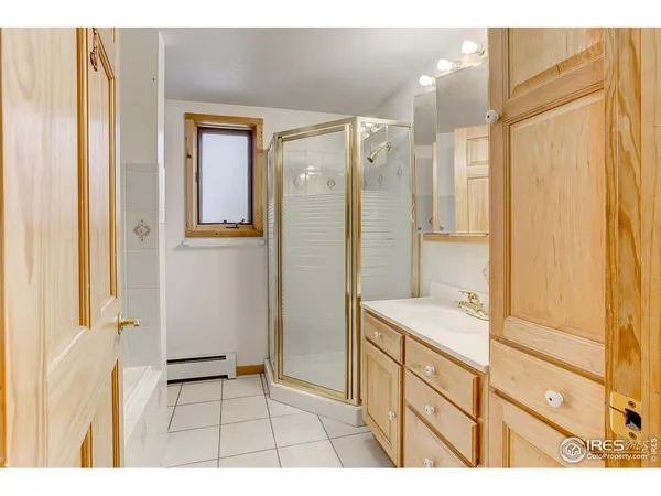 a bathroom with a sink a mirror and a shower