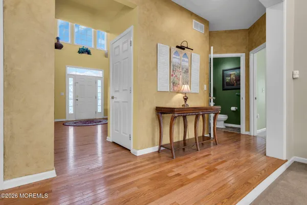 a view of a livingroom with furniture and hardwood floor