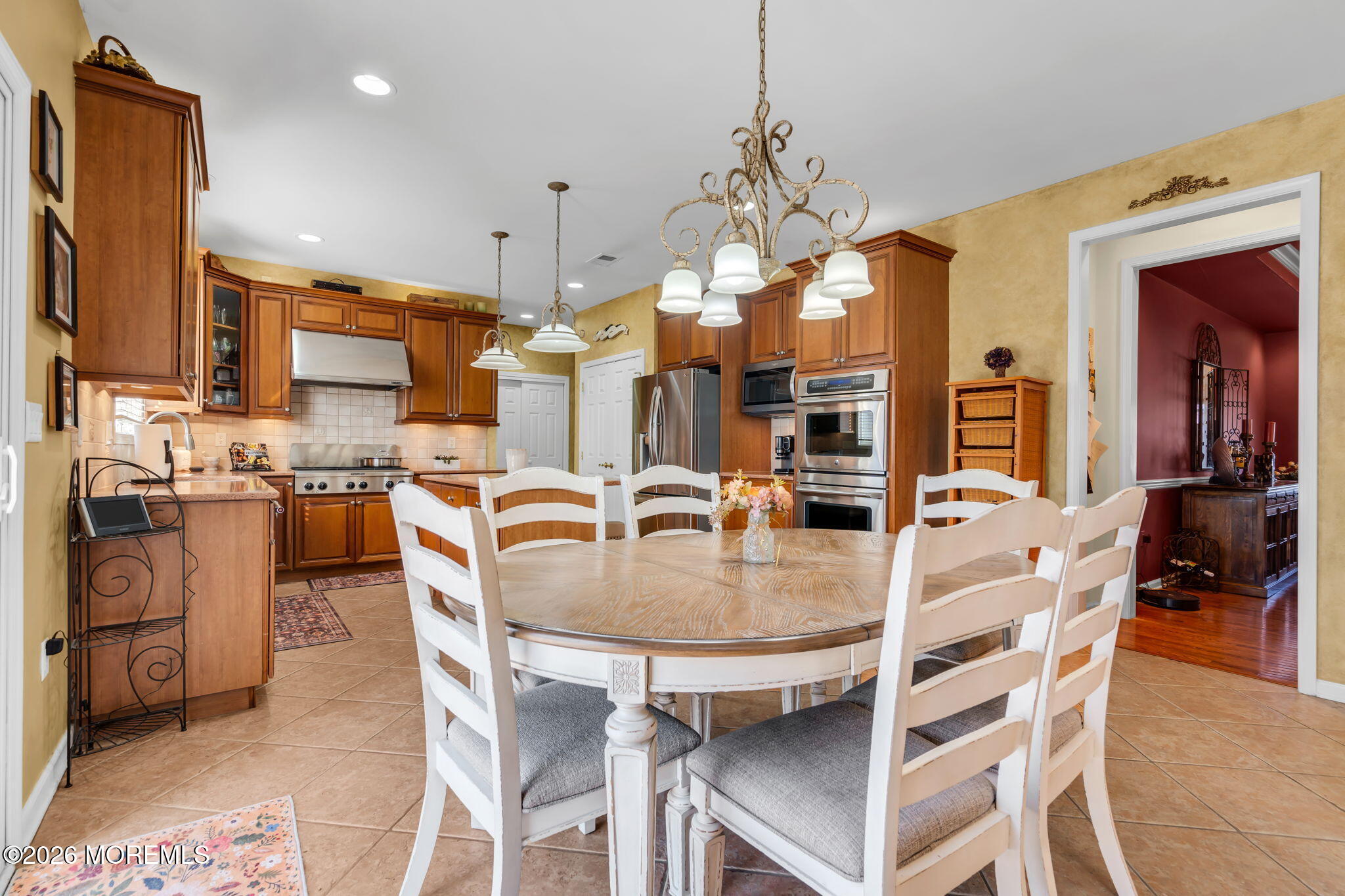 197 Benjamin Street Toms River, NJ 08755 - Photo 23 of 49 a dining room filled with furniture and a chandelier