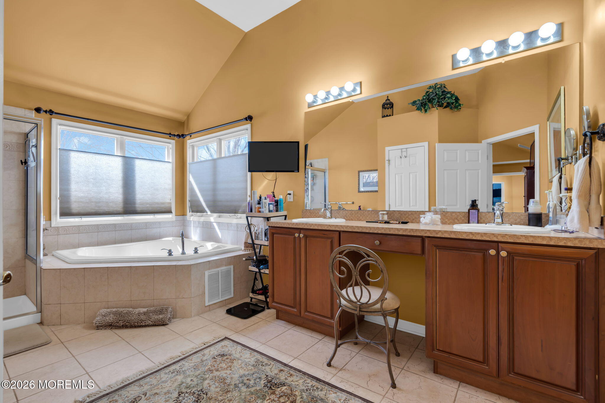 197 Benjamin Street Toms River, NJ 08755 - Photo 31 of 49 a spacious bathroom with a sink mirror and a bathtub
