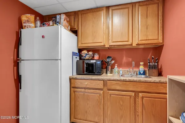 a white refrigerator freezer sitting in a kitchen