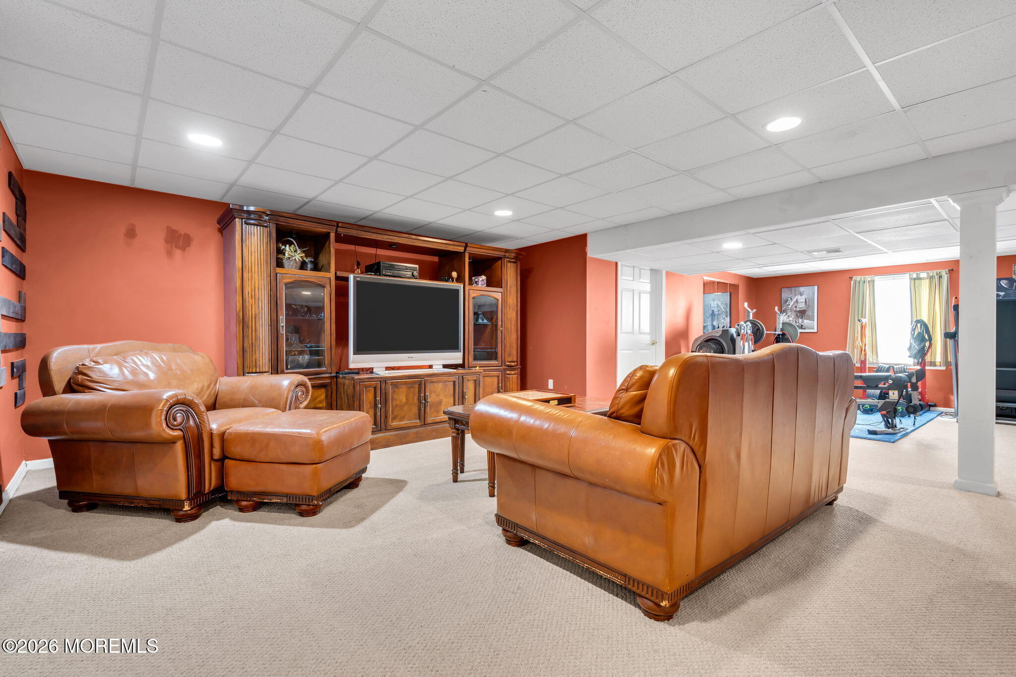 197 Benjamin Street Toms River, NJ 08755 - Photo 40 of 49 a living room with furniture a flat screen tv and a large window
