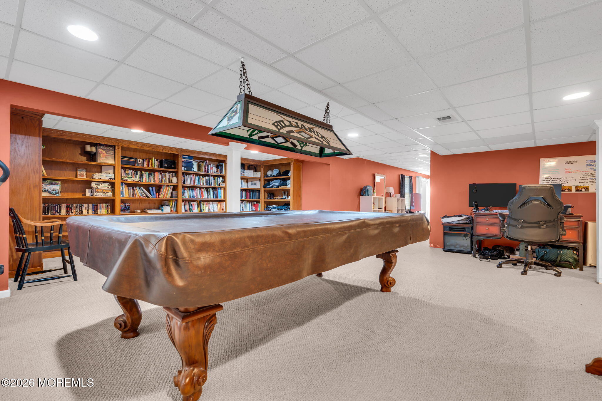 197 Benjamin Street Toms River, NJ 08755 - Photo 41 of 49 a living room with furniture gym equipment and a chandelier