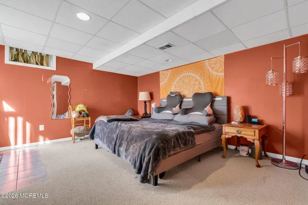 a bed room with a bed and a chair
