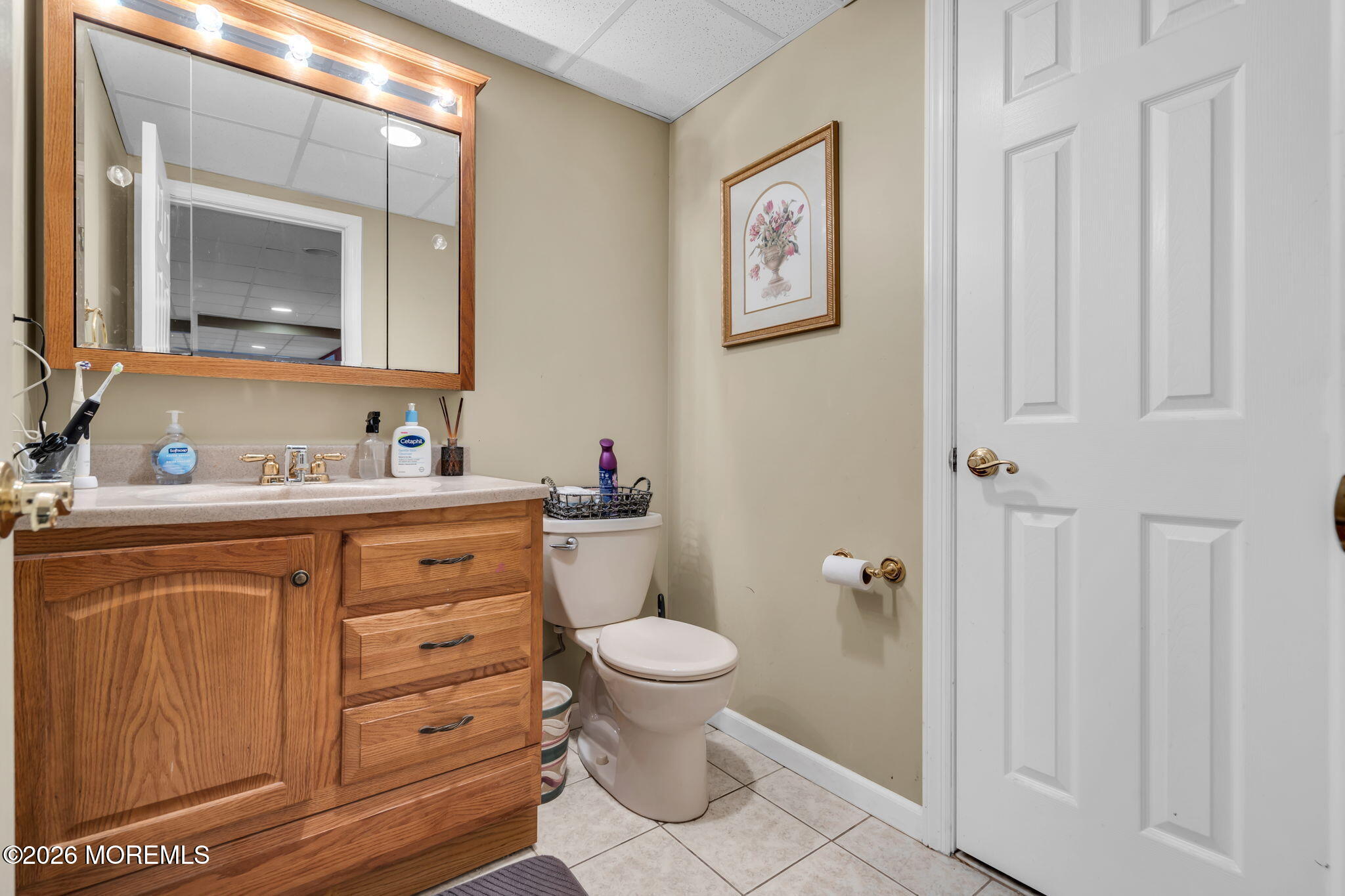 197 Benjamin Street Toms River, NJ 08755 - Photo 44 of 49 a bathroom with a toilet a sink and a mirror