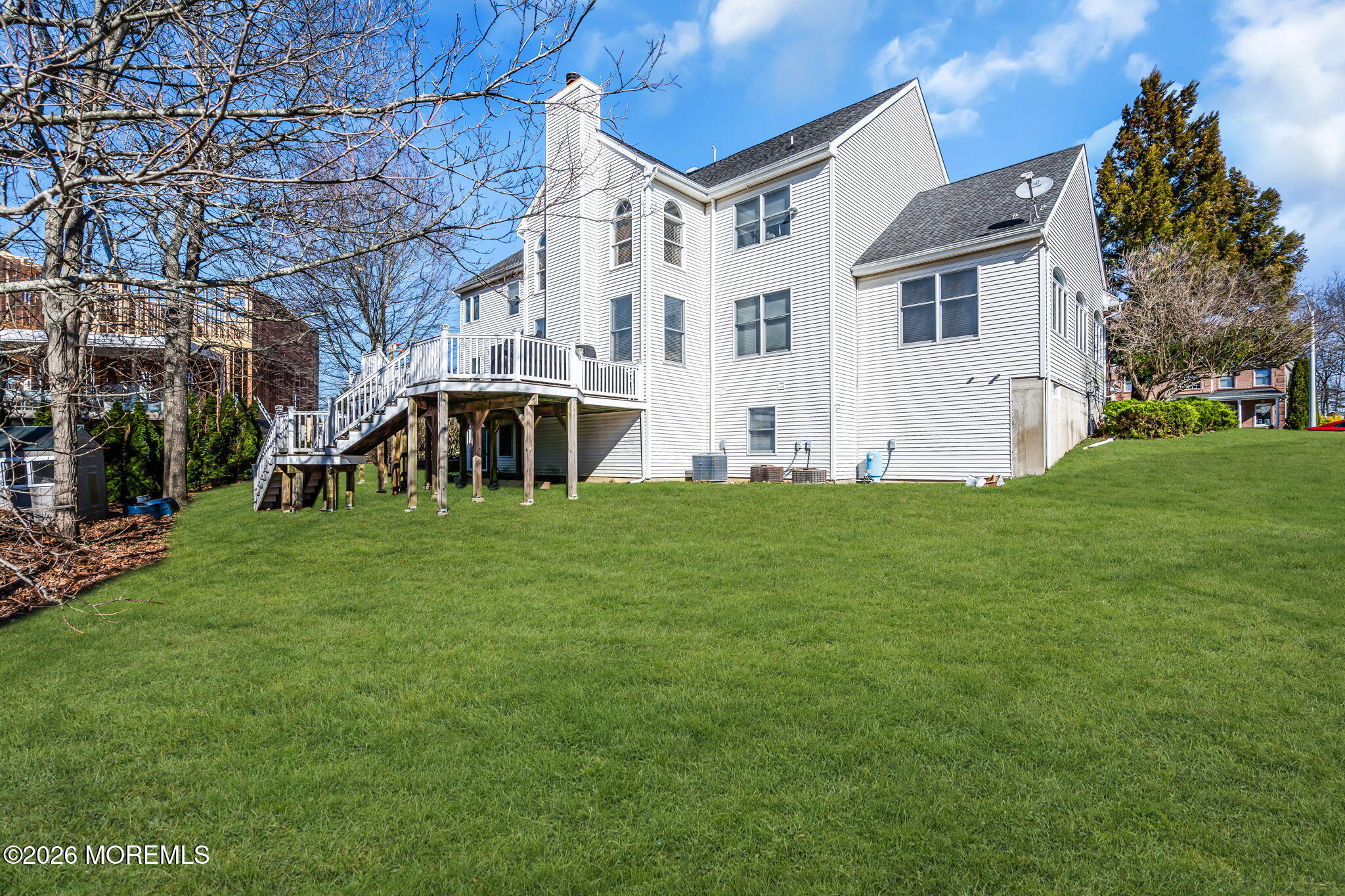 197 Benjamin Street Toms River, NJ 08755 - Photo 46 of 49 a view of a white house with a big yard and large trees