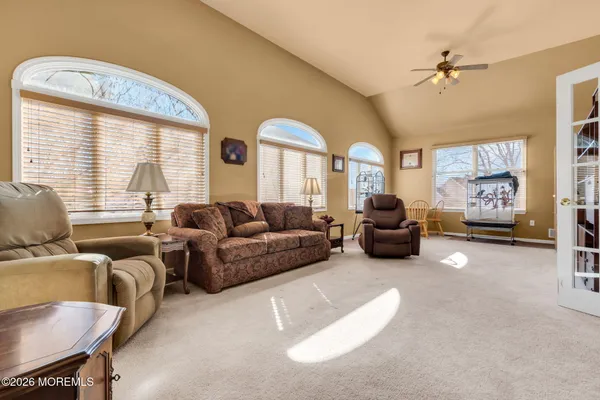 a living room with furniture and a large window