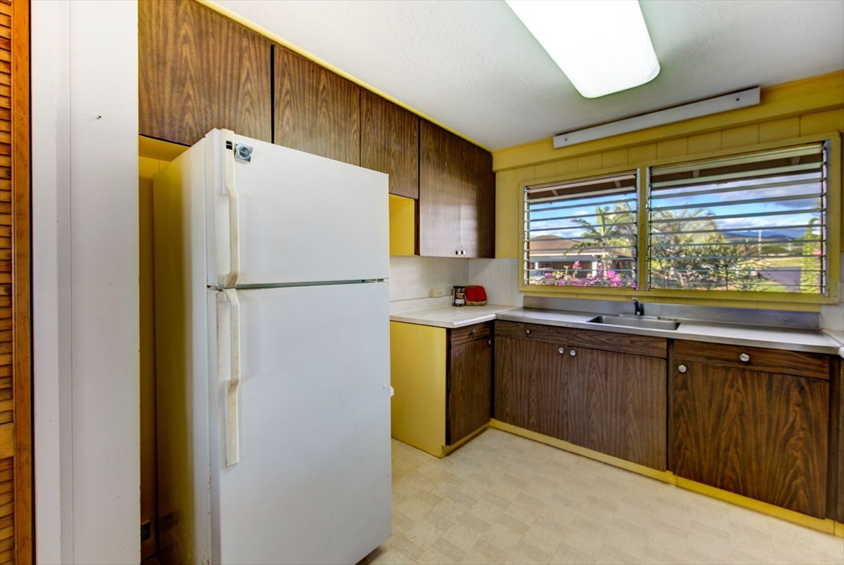 180 Ulaula Road Eleele, HI 96705 - Photo 11 of 23 a kitchen with a refrigerator and a sink