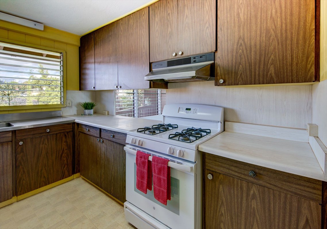 180 Ulaula Road Eleele, HI 96705 - Photo 12 of 23 a kitchen with a sink stove and cabinets