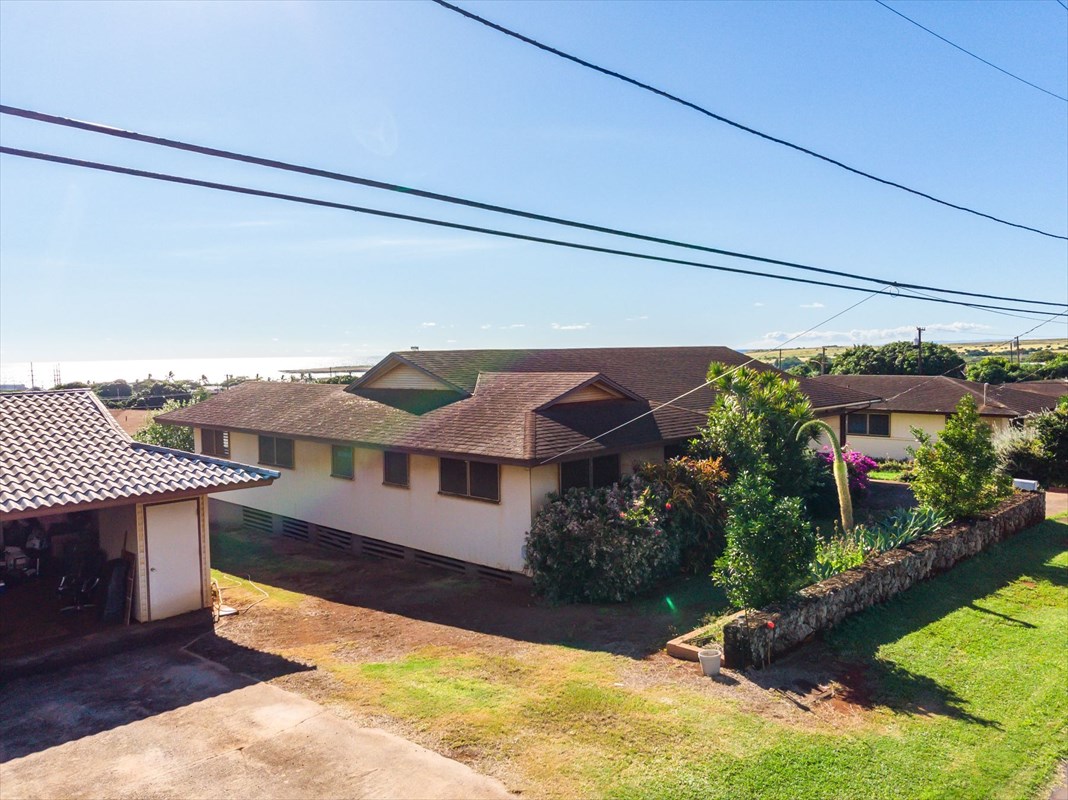 180 Ulaula Road Eleele, HI 96705 - Photo 16 of 23 a view of a house with a swimming pool