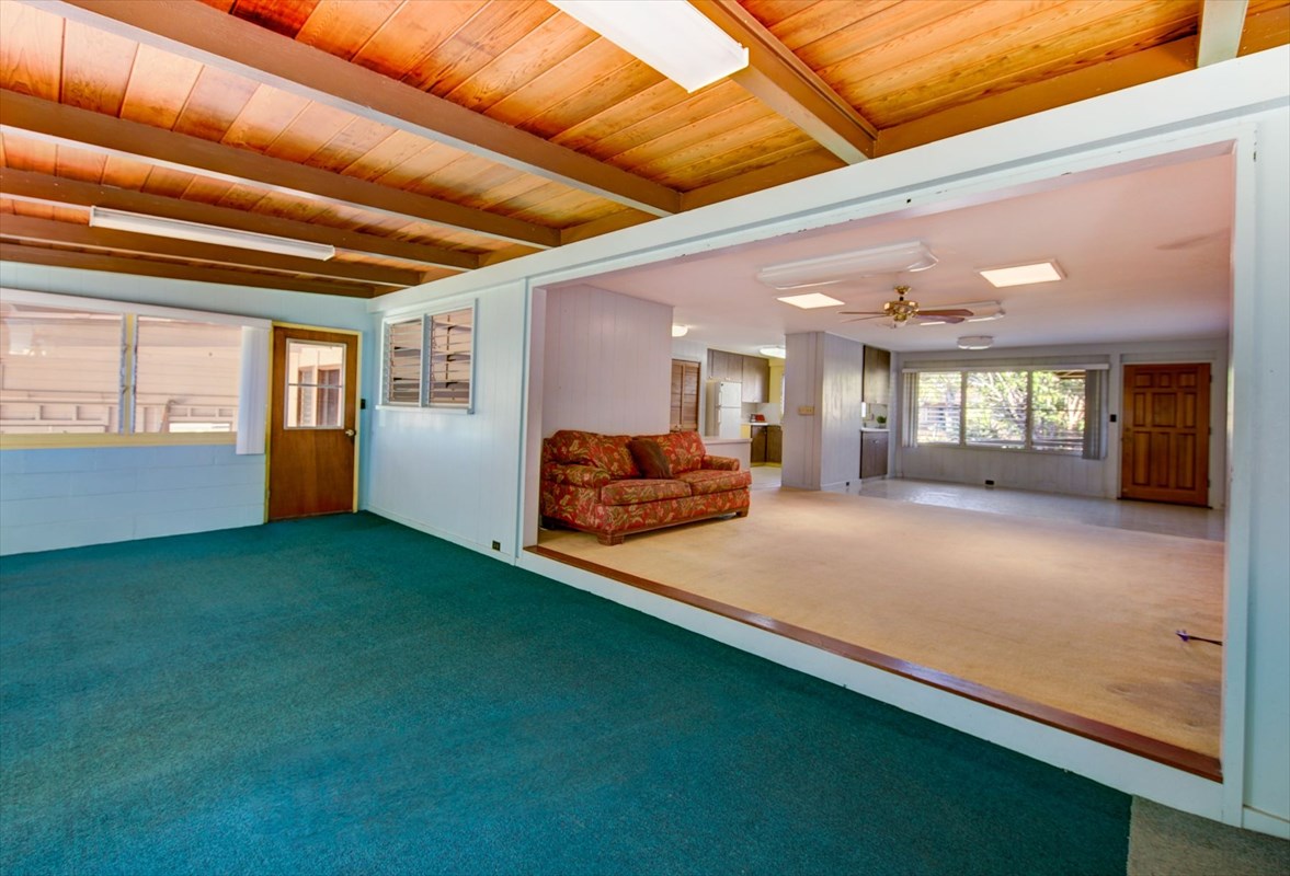 180 Ulaula Road Eleele, HI 96705 - Photo 8 of 23 a spacious bedroom with a bed and balcony view