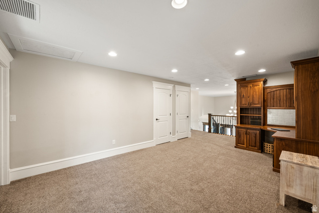 1205 North Elk Rdg Lane, Unit 202 Alpine, UT 84004 - Photo 56 of 88 Open loft space featuring built-in wood cabinetry, recessed lighting, and soft carpet flooring