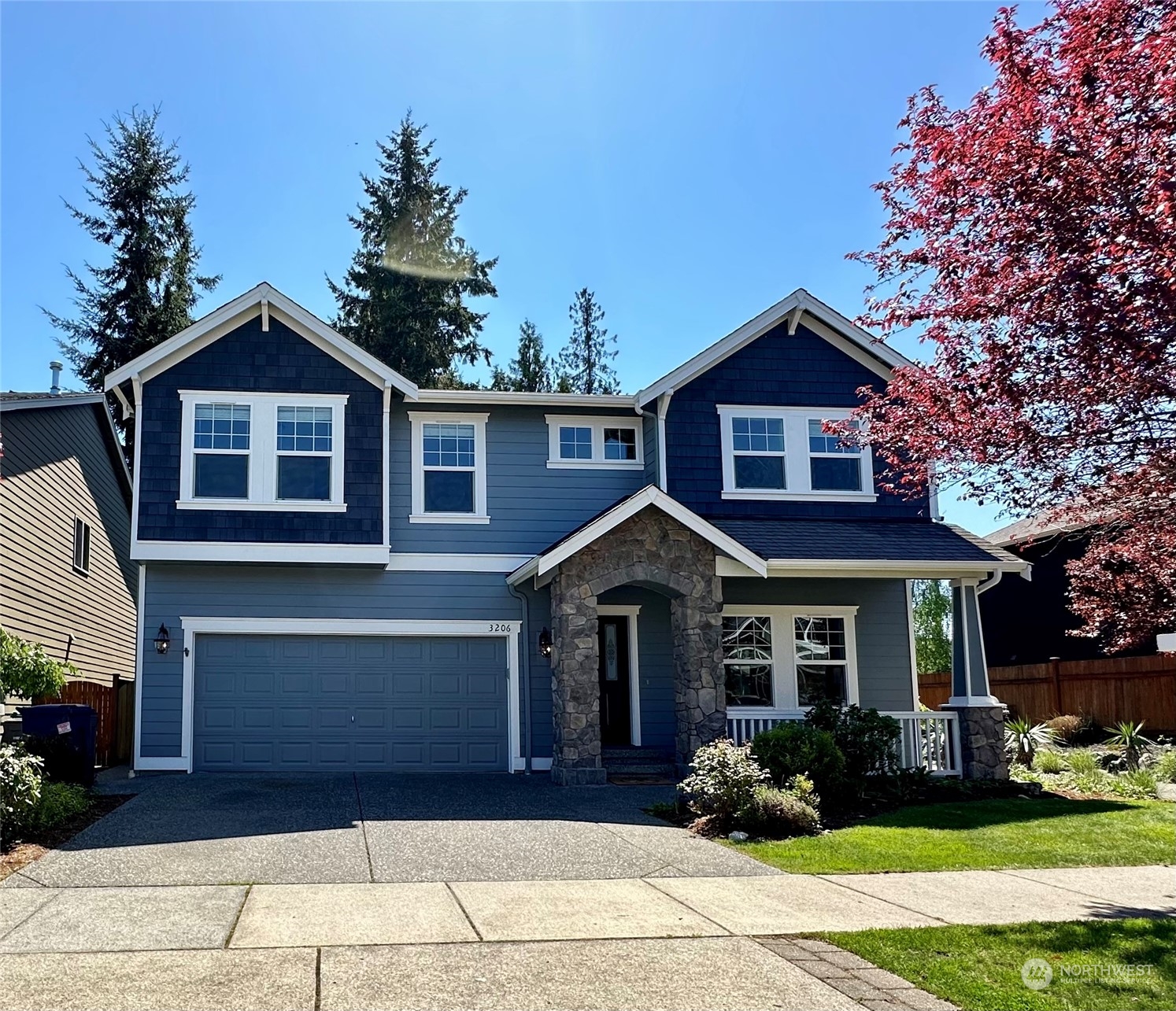 3206 172 Street Southeast Bothell, WA 98012 - Photo 1 of 35 a front view of a house with garden