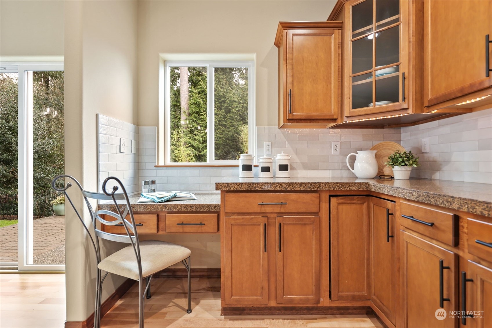 3206 172 Street Southeast Bothell, WA 98012 - Photo 11 of 35 a kitchen with granite countertop wooden cabinets and a granite counter tops
