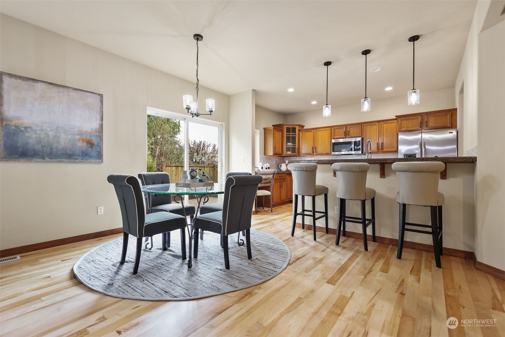 3206 172 Street Southeast Bothell, WA 98012 - Photo 13 of 35 a kitchen with a dining table chairs and entryway