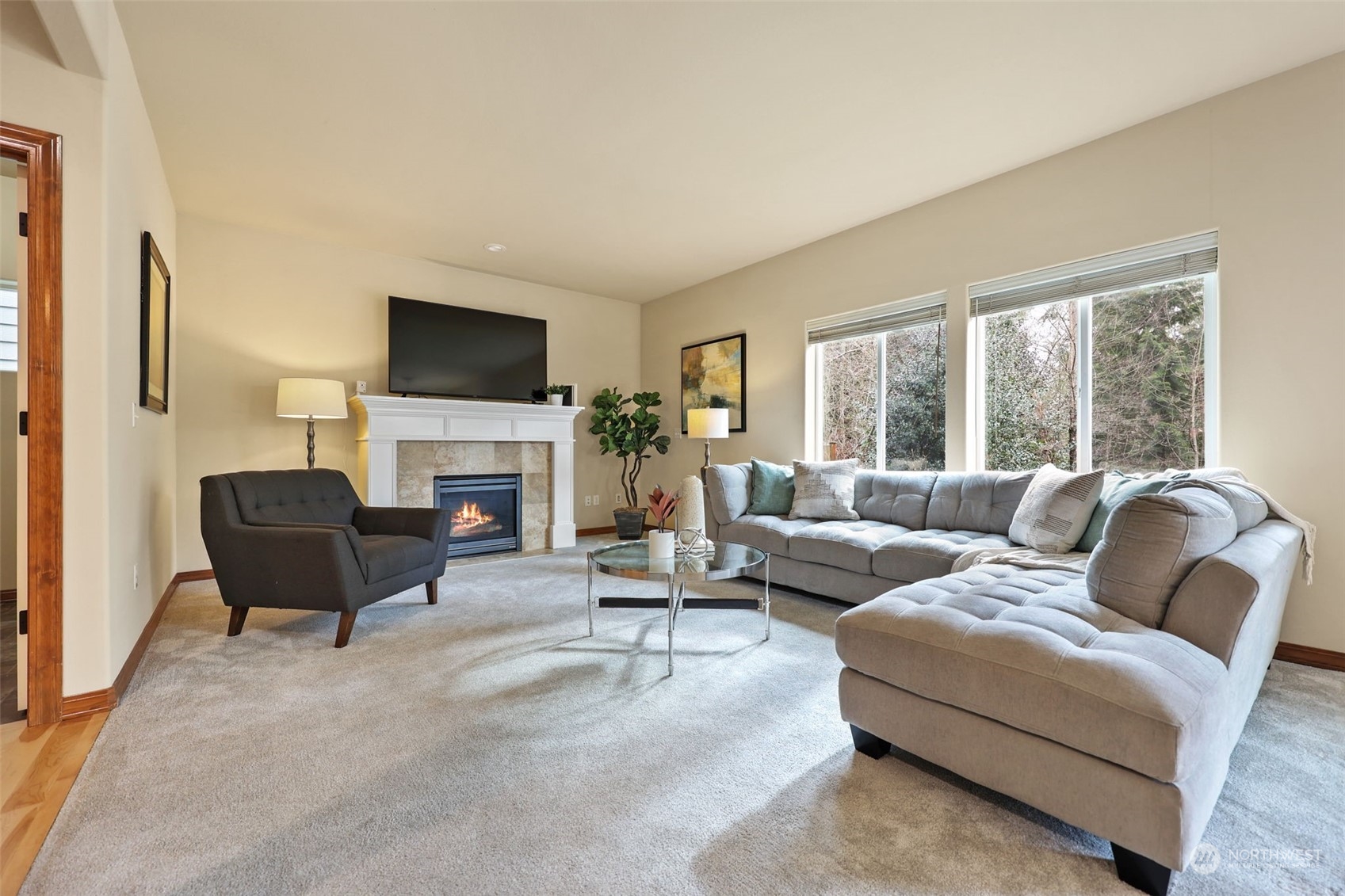 3206 172 Street Southeast Bothell, WA 98012 - Photo 14 of 35 a living room with furniture a fireplace and a flat screen tv
