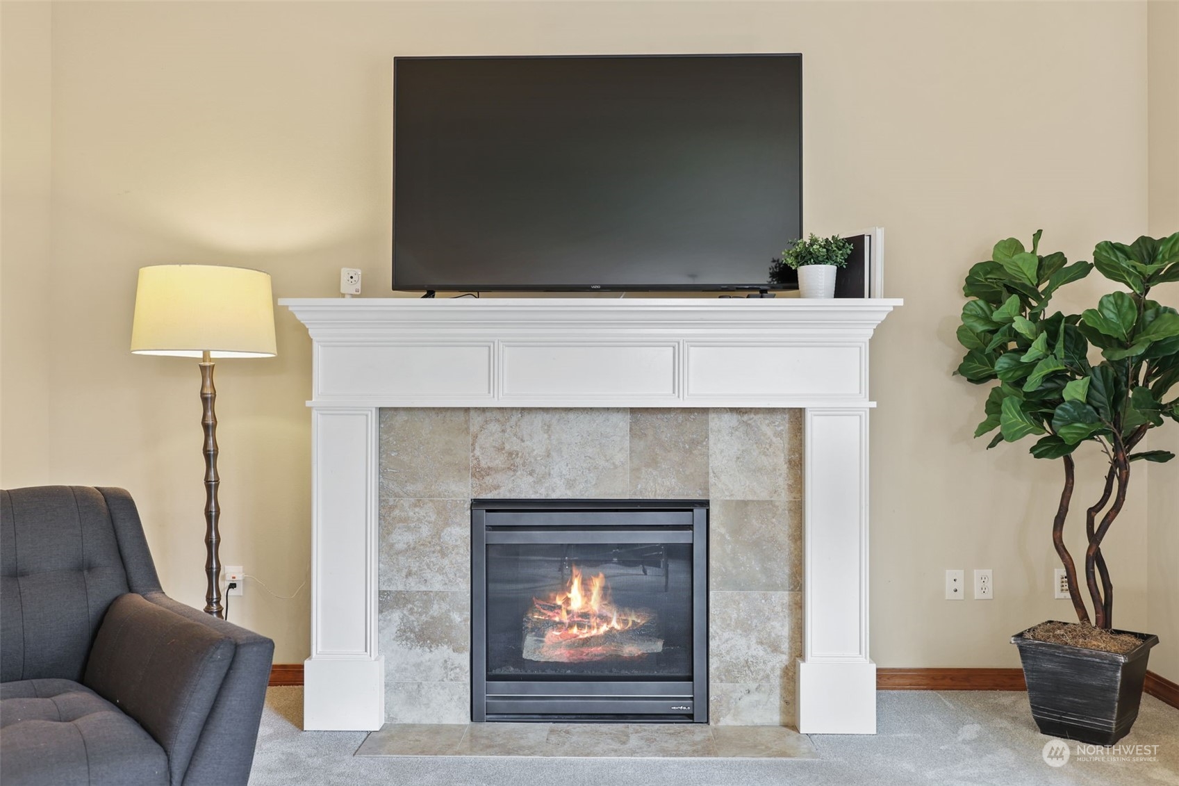 3206 172 Street Southeast Bothell, WA 98012 - Photo 15 of 35 a living room with furniture and a fireplace