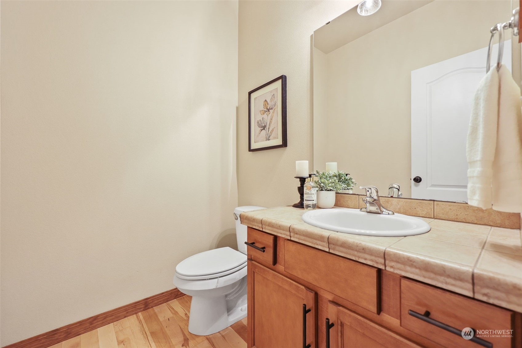 3206 172 Street Southeast Bothell, WA 98012 - Photo 19 of 35 a bathroom with a granite countertop toilet sink and mirror