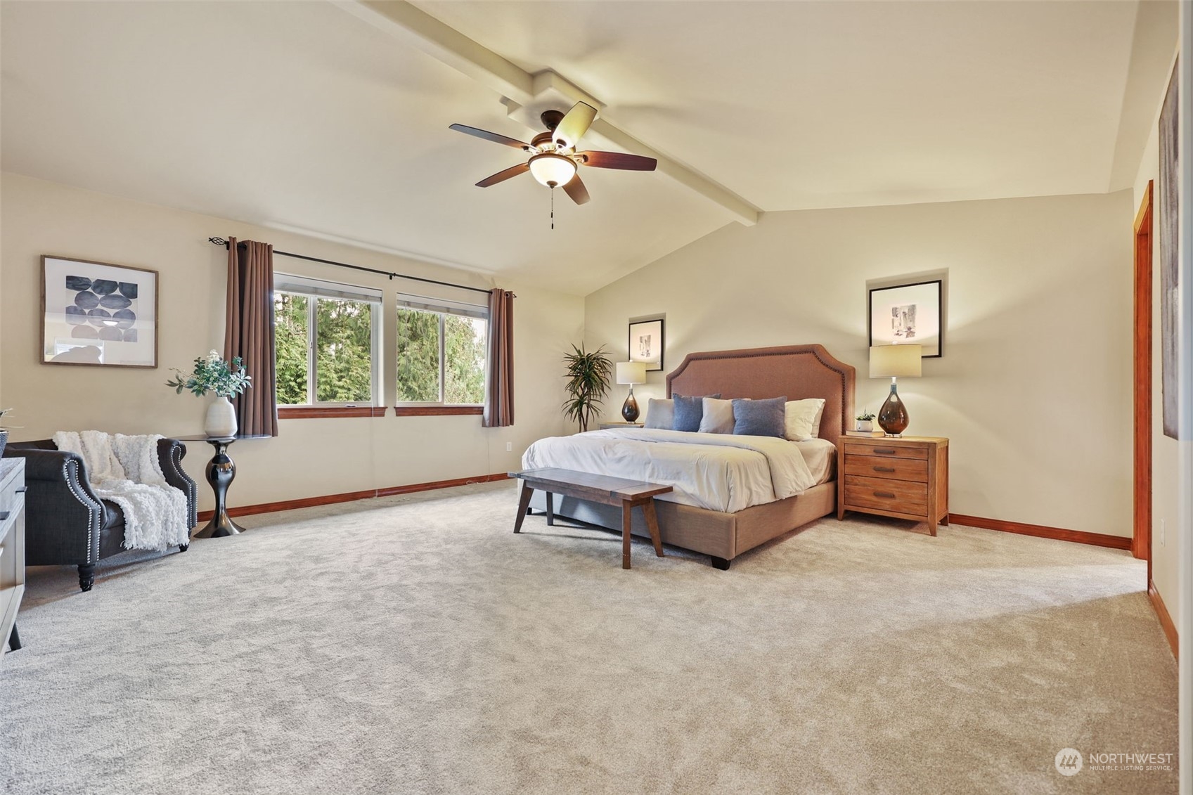 3206 172 Street Southeast Bothell, WA 98012 - Photo 29 of 35 a spacious bedroom with a bed and a table
