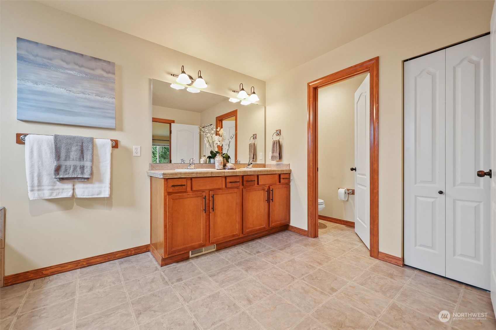 3206 172 Street Southeast Bothell, WA 98012 - Photo 30 of 35 a view of a bathroom with a sink and mirror