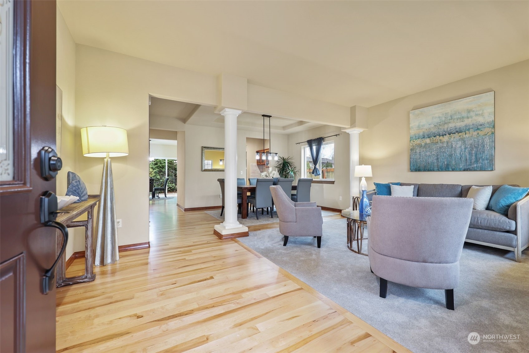 3206 172 Street Southeast Bothell, WA 98012 - Photo 3 of 35 a living room with furniture a wooden floor and a large window