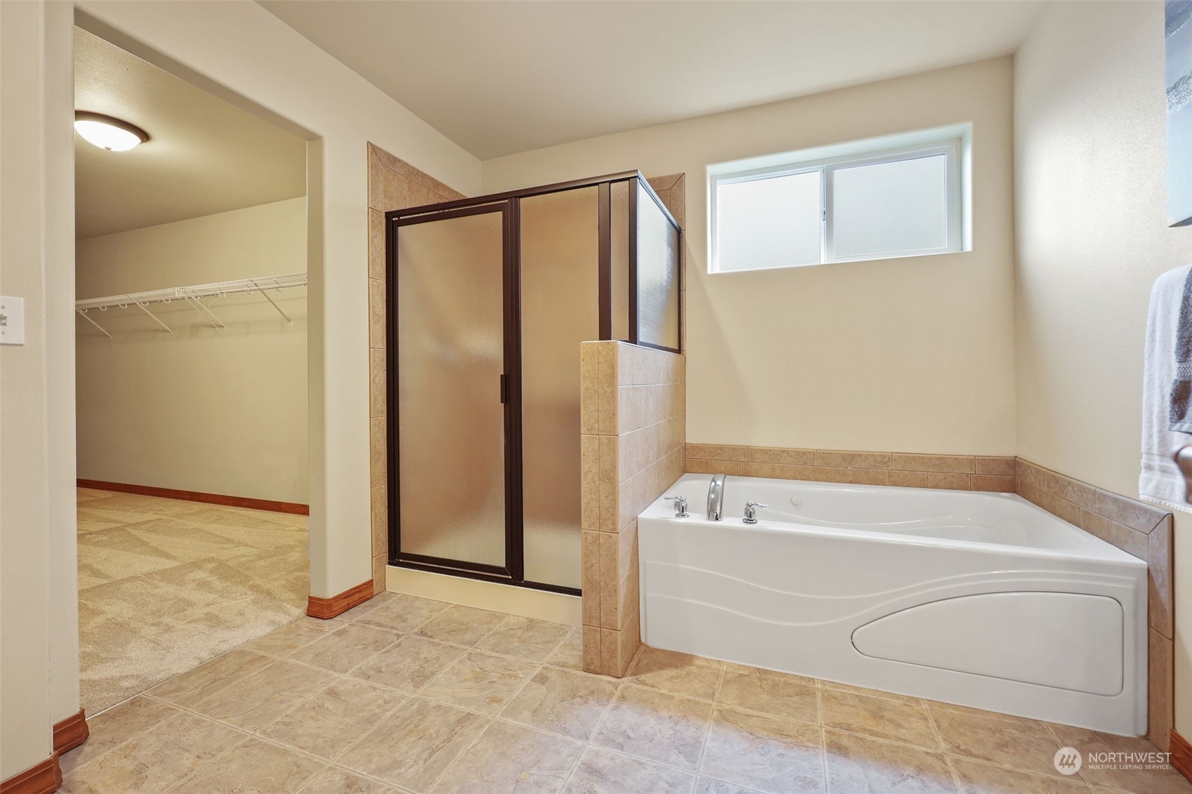 3206 172 Street Southeast Bothell, WA 98012 - Photo 31 of 35 a bathroom with a bathtub and a shower