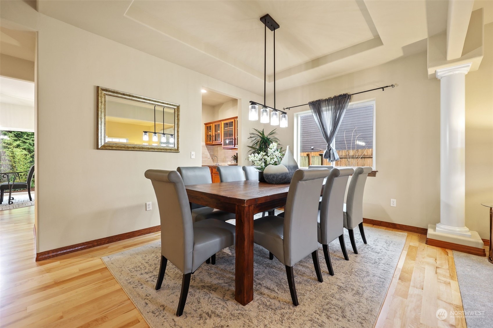 3206 172 Street Southeast Bothell, WA 98012 - Photo 6 of 35 a view of a dining room with furniture window and wooden floor