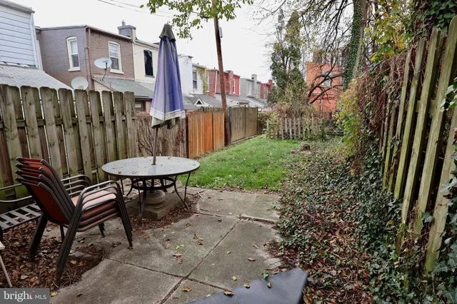 a view of a chairs and table in the patio