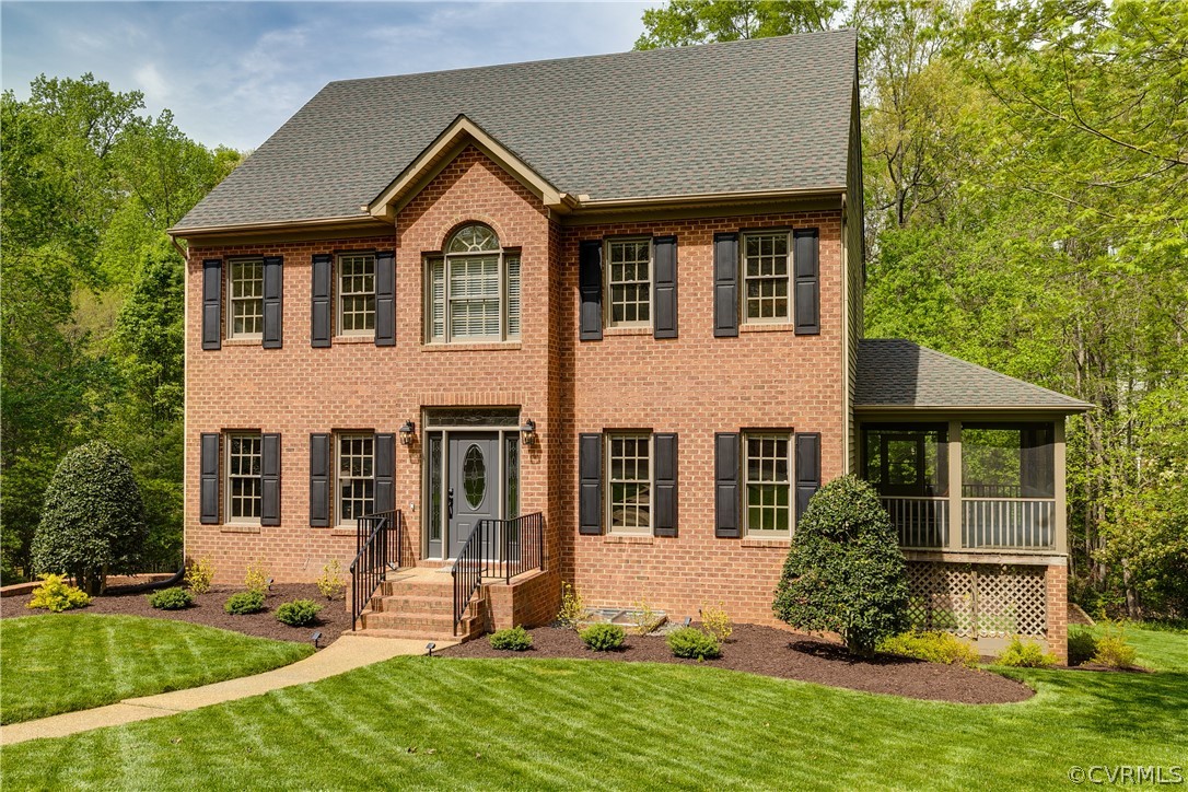 a front view of a house with a yard