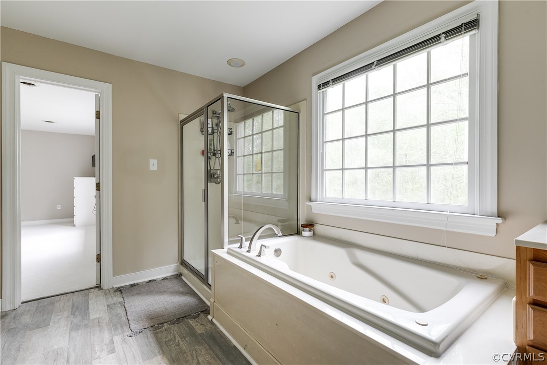 5304 West Shore Road Midlothian, VA 23112 - Photo 23 of 47 a bathroom with a tub and a sink