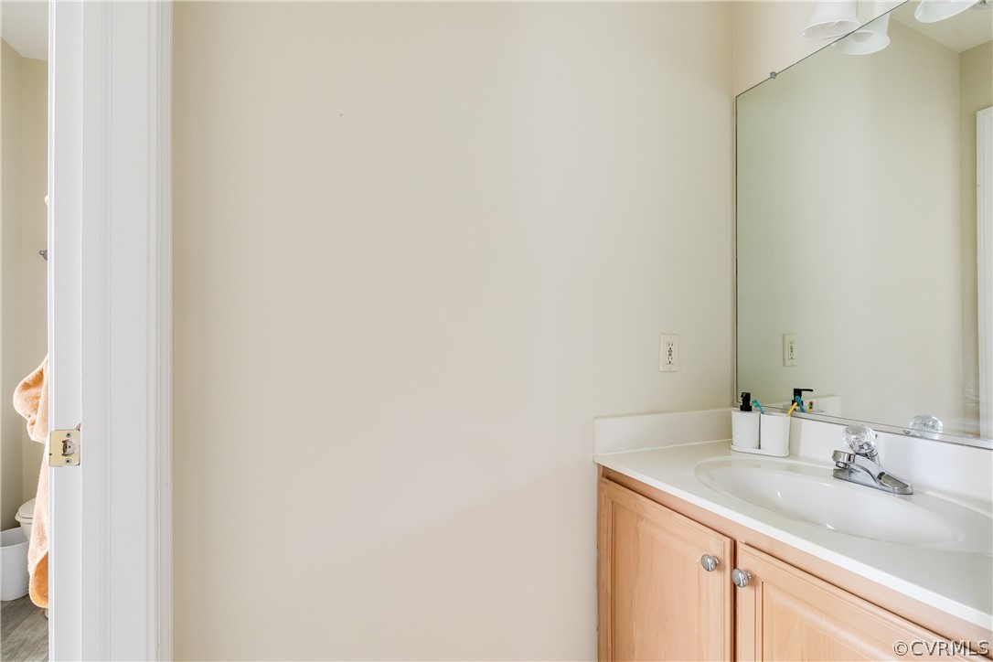 5304 West Shore Road Midlothian, VA 23112 - Photo 28 of 47 a bathroom with a sink and a mirror
