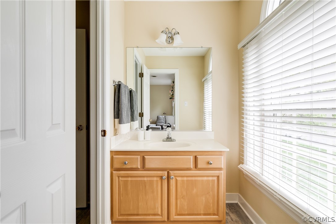 5304 West Shore Road Midlothian, VA 23112 - Photo 30 of 47 a bathroom with a sink and a mirror
