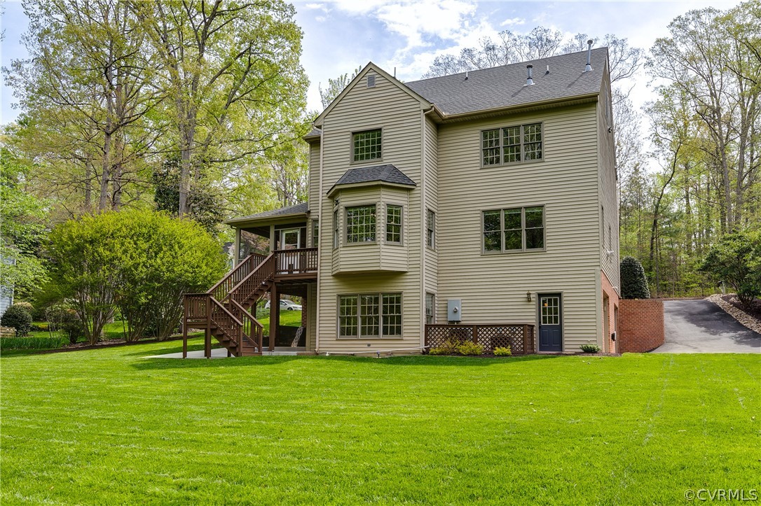 5304 West Shore Road Midlothian, VA 23112 - Photo 43 of 47 a front view of a house with a garden